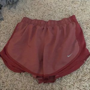 Dark red Nike shorts